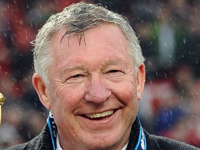 (FILES) In this file photo taken on May 12, 2013 Manchester United's Scottish manager Alex Ferguson holds the Premier League trophy at the end of the English Premier League football match between Manchester United and Swansea City at Old Trafford in Manchester, northwest England. Legendary former Manchester United manager Alex Ferguson has undergone emergency surgery for a brain haemorrhage, his old club announced May 5, 2018. / AFP PHOTO / Andrew YATES