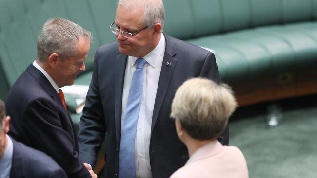 Foes reunite: Bill Shorten and Scott Morrison shake hands before being sworn in at the start of the 46th Parliament. Picture: Kym Smith