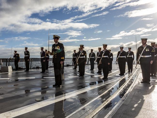 Lieutenant Matthew Thomson brings HMAS Sydney’s Parade Guard guard to attention for inspection during the ship’s commissioning ceremony. *** Local Caption *** The Royal Australian Navy has welcomed its newest Air Warfare Destroyer into the fleet with the first ever commissioning of an Australian warship at sea, off the coast of New South Wales. The ceremony marked the moment the 147-metre long Air Warfare Destroyer HMAS Sydney (V) became one of Her Majesty’s Australian Ships. Sydney is the last of three Hobart Class vessels built for Navy at Osborne in South Australia and is based on the Navantia F100 frigate design. She is equipped with advanced combat systems, providing the ship with layered offensive and defensive capabilities to counter conventional and asymmetric threats. Sydney will now undergo her test and evaluation period where she will integrate into the fleet and Navy personnel will develop their proficiencies with her cutting-edge Aegis combat system. Sydney and her sister ships, Hobart and Brisbane, are based at Garden Island in Sydney.