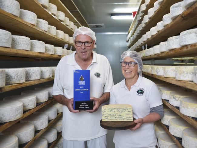 Berrys Creek Cheese owners Barry Charlton and Cheryl Hulls in their cheese storage room with their winning Oak Blue Cheese. Picture: Dannika Bonser