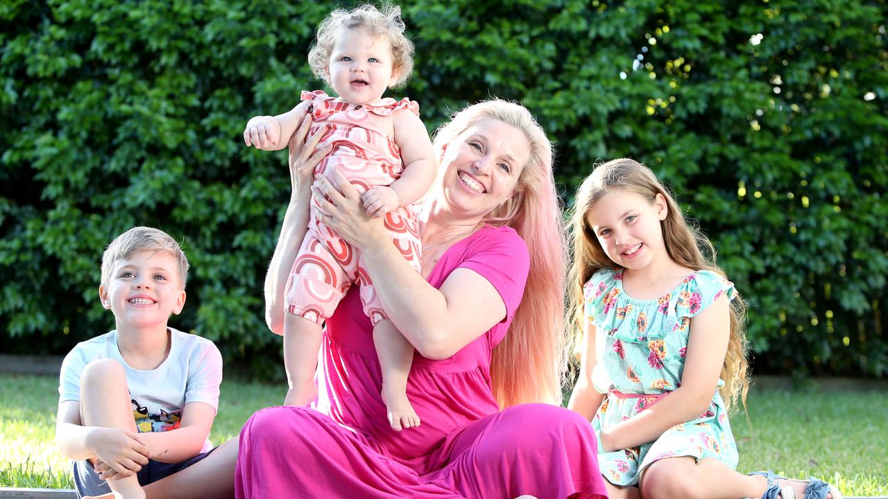 Michelle Dagan with son Elijah, 7, holding Eva and eldest daughter, Mia, 9. Photo: Steve Pohlner.