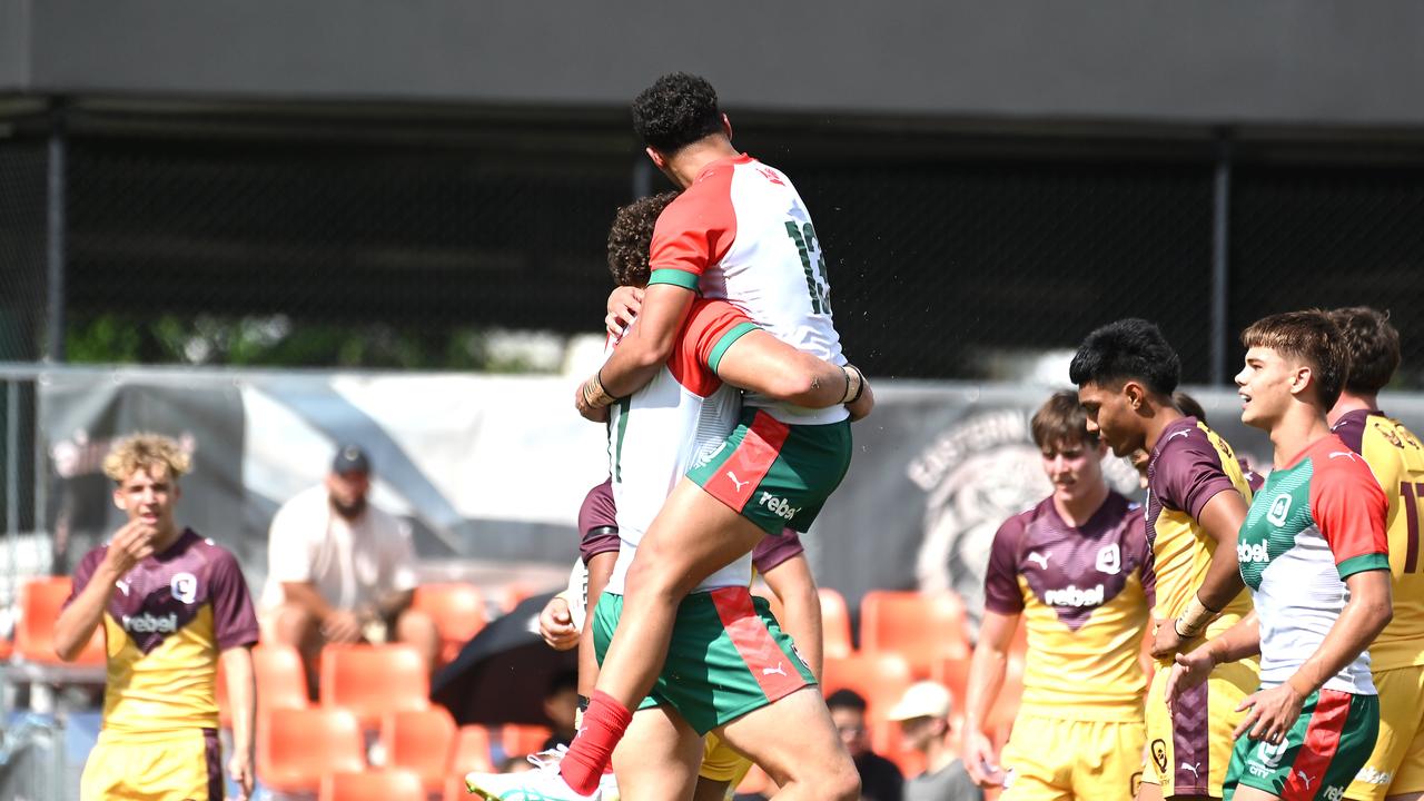 Jared Horne leaps into the arms of Wavell SHS teammate Kobi Floro - Under 17 City v Country Boys rugby league. Saturday 13, 2024. Picture, John Gass