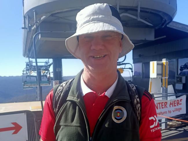 60-year-old blind Glen Waverley man Paul Holmes has climbed the tallest mountain in Australia, Mt Kosciuszko.