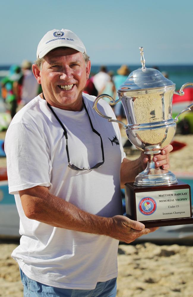 Tim Ryan holding the Matthew Barclay memorial trophy at North Kirra beach.