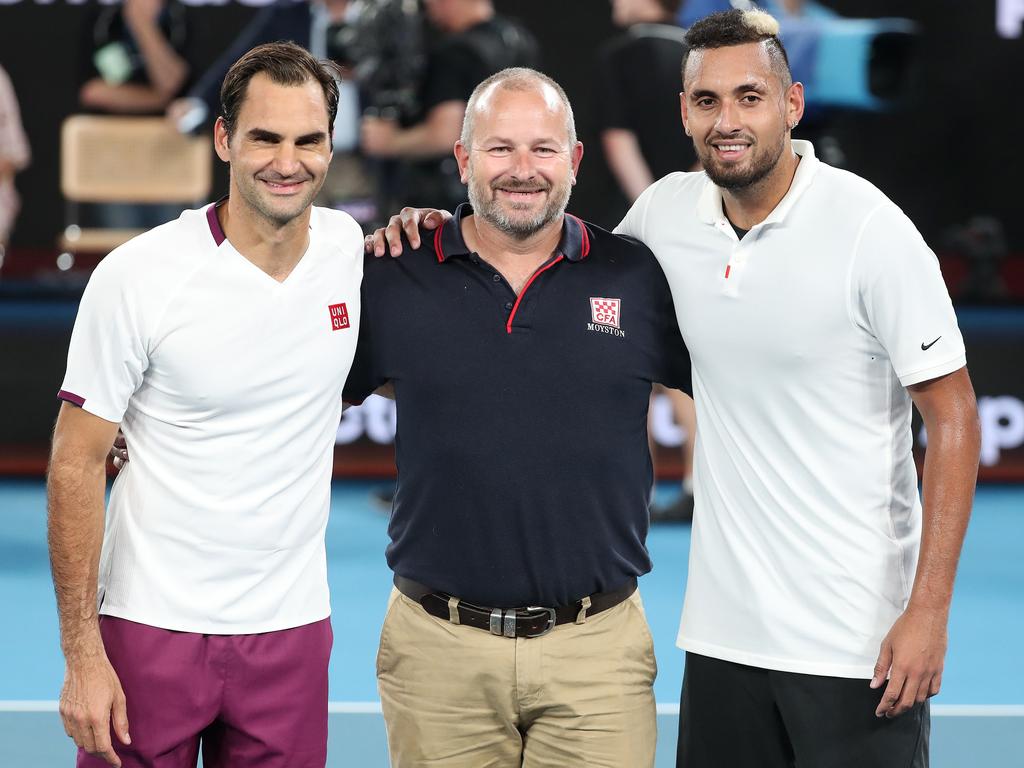 CFA firefighter Alistair Mason with Roger Federer and Nick Kyrgios.