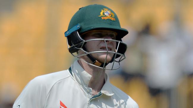 Australian captain Steve Smith walks back to the pavilion after his dismissal for 28 runs during the fourth day of the second Test match between India and Australia.