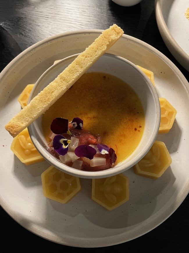 Leatherwood’s creme brulee that comes with a perfectly scorched top and a finger of lemon myrtle shortbread and rhubarb compote. Picture: Supplied