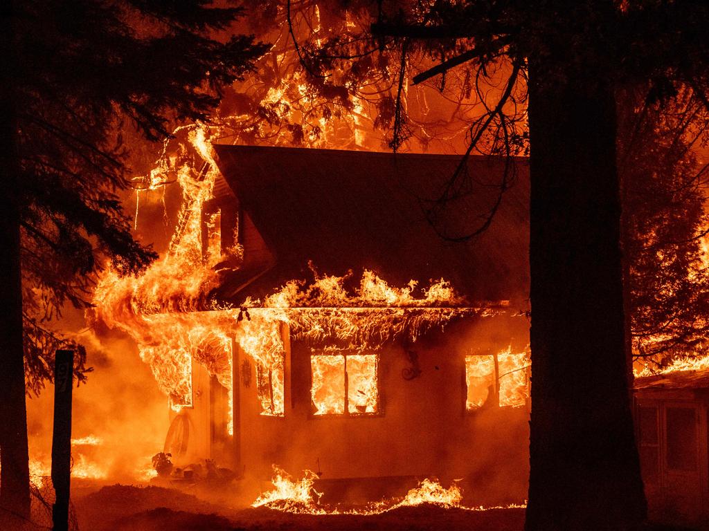 A home burns during the Dixie fire on July 24, 2021, in the Indian Falls neighborhood of unincorporated Plumas County, California. - The Dixie fire has now burned more than 200,000 acres and is the largest fire of the year for California. (Photo by JOSH EDELSON / AFP)