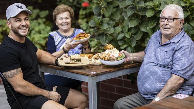 Kosta Grillas with his grandparents Sasa and Spiros Tsangaris. Picture: Eddie Safarik