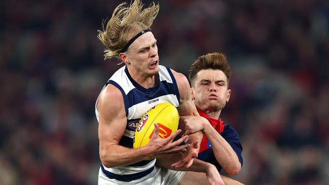 MELBOURNE, AUSTRALIA - MAY 04: Zach Guthrie of the Cats marks infront of Bayley Fritsch of the Demons during the round eight AFL match between Melbourne Demons and Geelong Cats at Melbourne Cricket Ground, on May 04, 2024, in Melbourne, Australia. (Photo by Quinn Rooney/Getty Images)