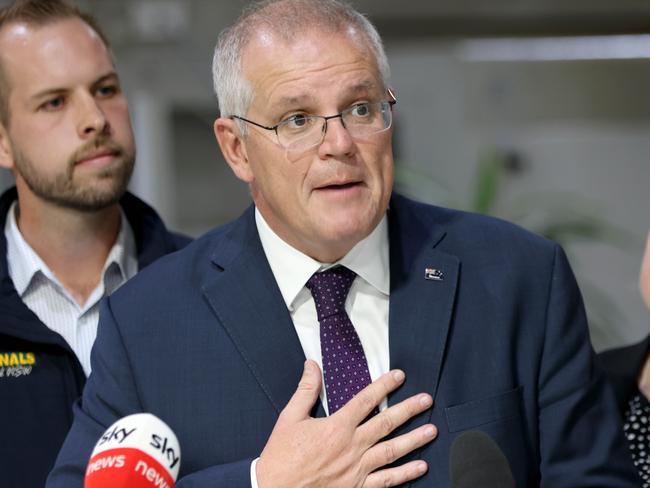 DAILY TELEGRAPH, APRIL 06, 2022: Prime minister Scott Morrison pictured speaking to media on his visit to NuPress in Cardiff In Newcastle with local candidates James Thomson (National candidate for the seat of Hunter) and Nell McGill Liberal candidate for Shortland.Picture: Damian Shaw