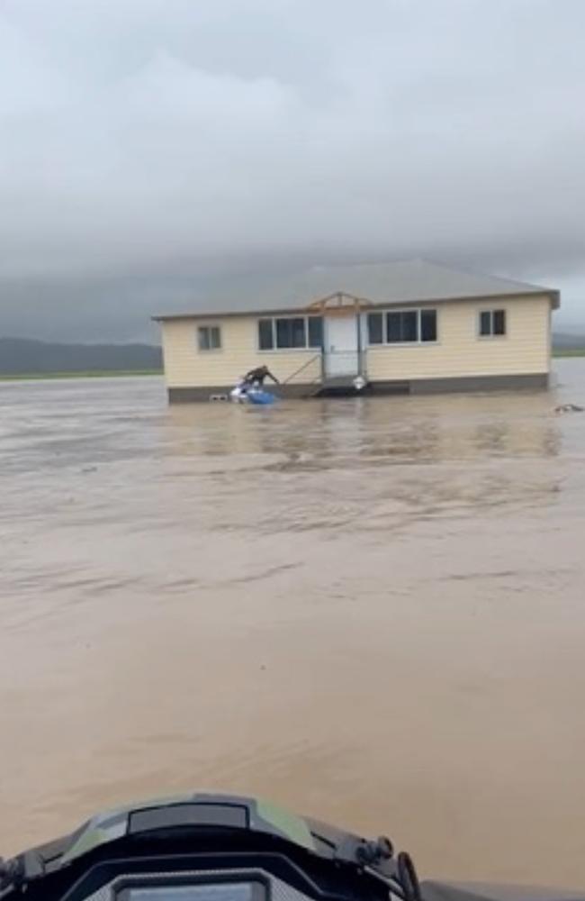 Joel Parkinson and a friend rescue a family from a flooded house in Northern NSW. Video: Joel Parkinson