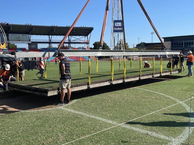 The drop in cricket pitch being installed at TIO Stadium. Picture: Max Hatzoglou