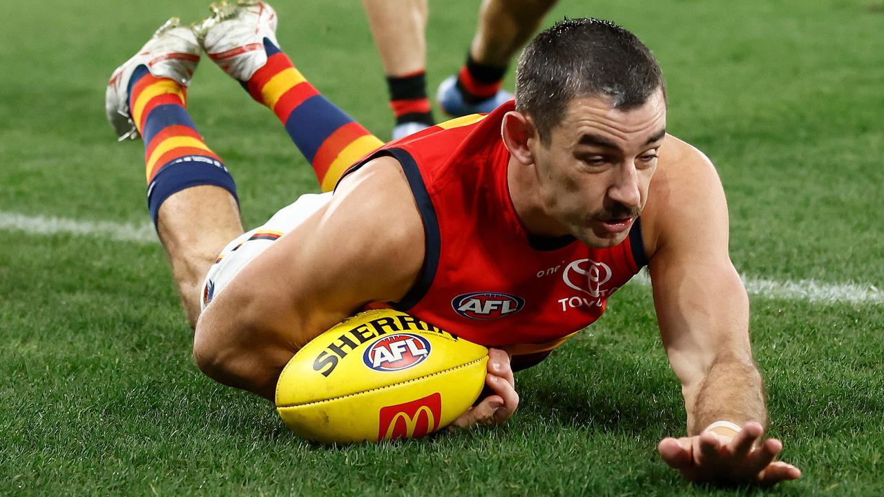 Taylor Walker takes a diving mark. Picture: Michael Willson/AFL Photos via Getty Images