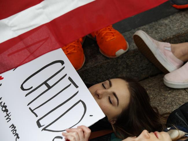 AHigh school students laid down in protest outside of the White House. Picture: AP/Evan Vucci