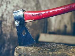 Woman armed with axe pours petrol on herself