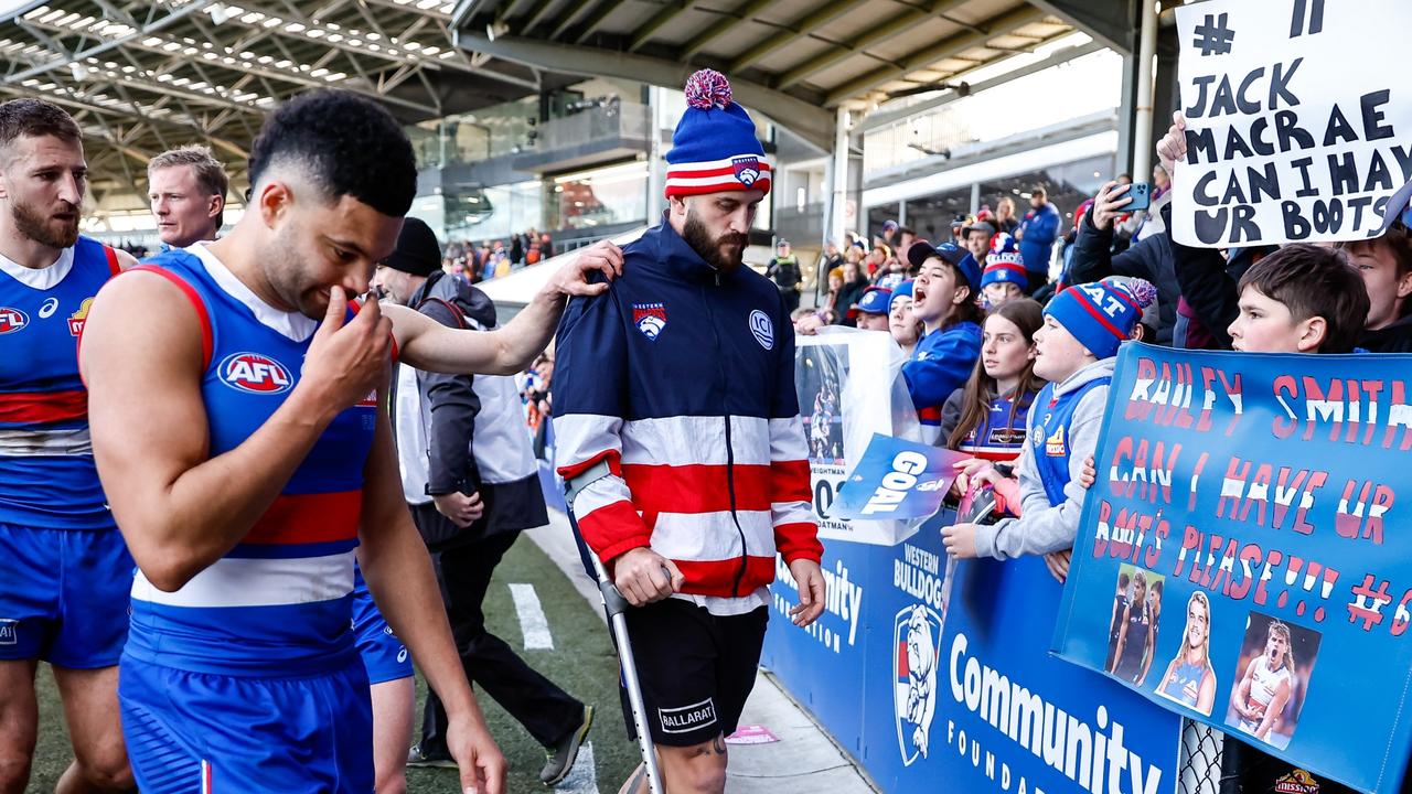 Josh Bruce hobbles off Mars Stadium on crutches. Picture: Dylan Burns/AFL Photos via Getty Images