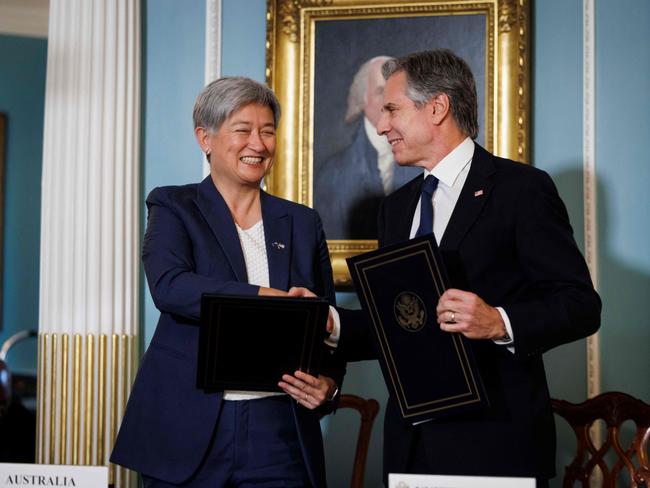 US Secretary of State Antony Blinken shakes hands with Autsralian Foreign Minister Penny Wong during a signing ceremony of the memorandum of understanding on Countering Foreign State Information Manipulation and a joint communiquÃ© on the US-Australia Landsat Next 2030 International Partnership Initiative, at the State Department in Washington, DC, on August 5, 2024. (Photo by Ting Shen / AFP)