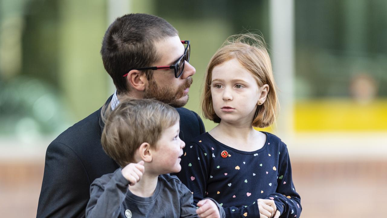 Taylor Digweed with kids Henry and Lucy Digweed watch the march to the Mothers' Memorial for the mid-morning Toowoomba Anzac Day service, Tuesday, April 25, 2023. Picture: Kevin Farmer