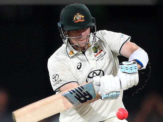 BRISBANE, AUSTRALIA - JANUARY 27: Steve Smith of Australia hits the ball to the boundary for a four during day three of the Second Test match in the series between Australia and West Indies at The Gabba on January 27, 2024 in Brisbane, Australia. (Photo by Bradley Kanaris/Getty Images)