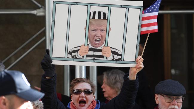 Anti-Trump demonstrators gather outside Manhattan Criminal Cour ahead of Donald Trump’s expected arrest. Picture: Getty Images via AFP.