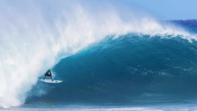 USA’s Parker Coffin practices surfing off Pupukea, Hawaii, after the Lexus Pipe Pro event was cancelled due to unexpectedly large and dangerous waves. Picture: Brian Bielmann/AFP