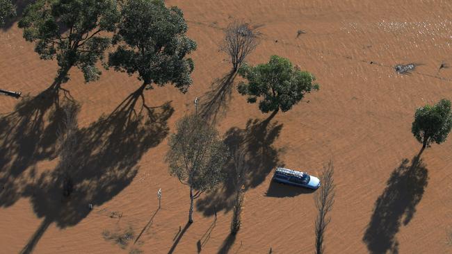 A ute sits submerged in flood waters on Cawdor Rd, Camden. Picture: Toby Zerna