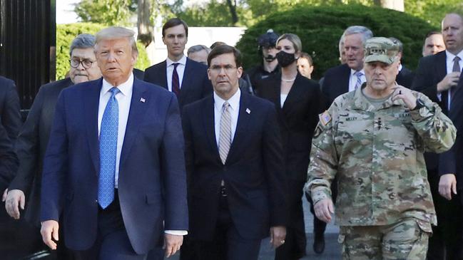 President Trump departs the White House on June 1 with General Mark Milley, far right, and others. Picture: AP