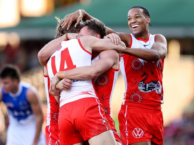 SYDNEY, AUSTRALIA - JULY 13: Callum Mills of the Swans celebrates kicking a goal with team mates during the round 18 AFL match between Sydney Swans and North Melbourne Kangaroos at SCG, on July 13, 2024, in Sydney, Australia. (Photo by Brendon Thorne/AFL Photos/via Getty Images)