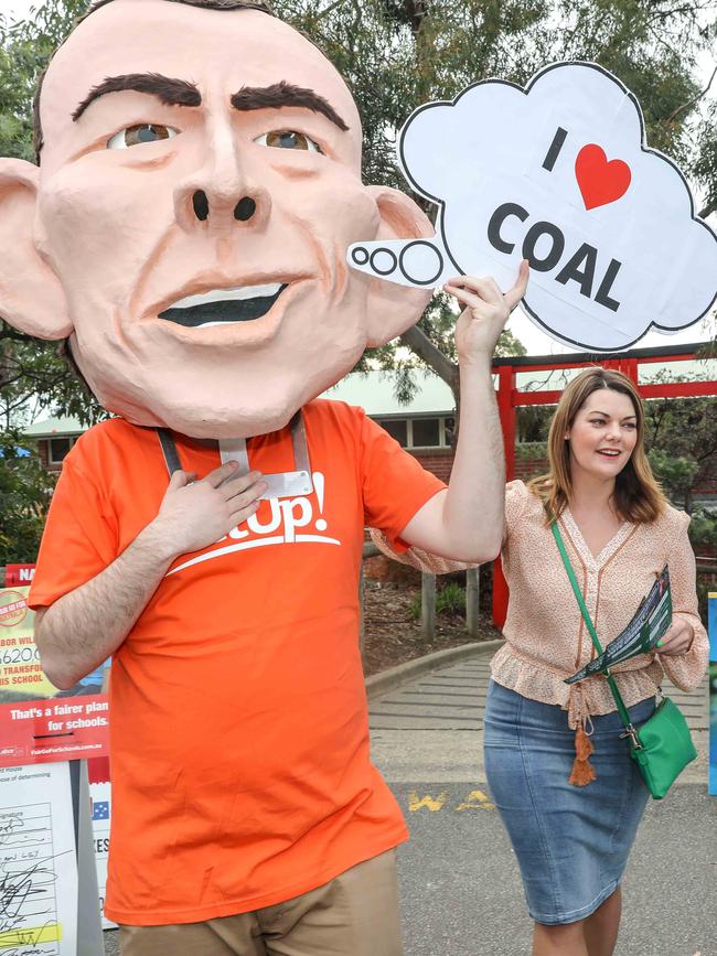 Greens senator Sarah Hanson-Young joins a GetUp! campaigner at a polling booth earlier this year. Picture: AAP