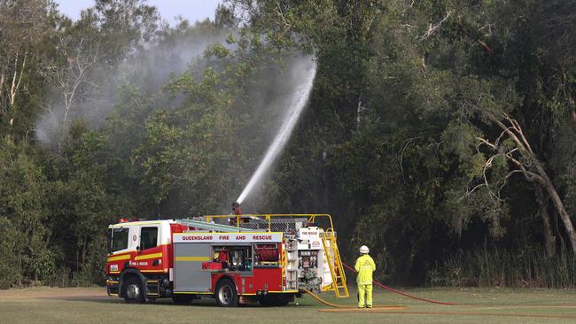 Firefighters on scene at the Helensvale bushfire yesterday. Photo: Tim Marsden