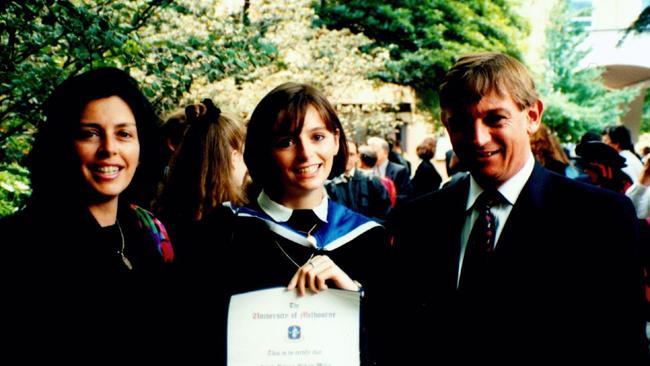 Sarah Harden with her parents Louise and Michael graduating from the University of Melbourne. Photo: Supplied