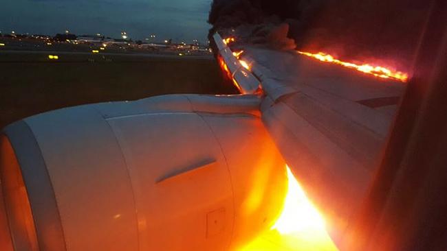 The right wing caught fire as the plane made an emergency landing at Changi airport. Picture: Douglas Yew.