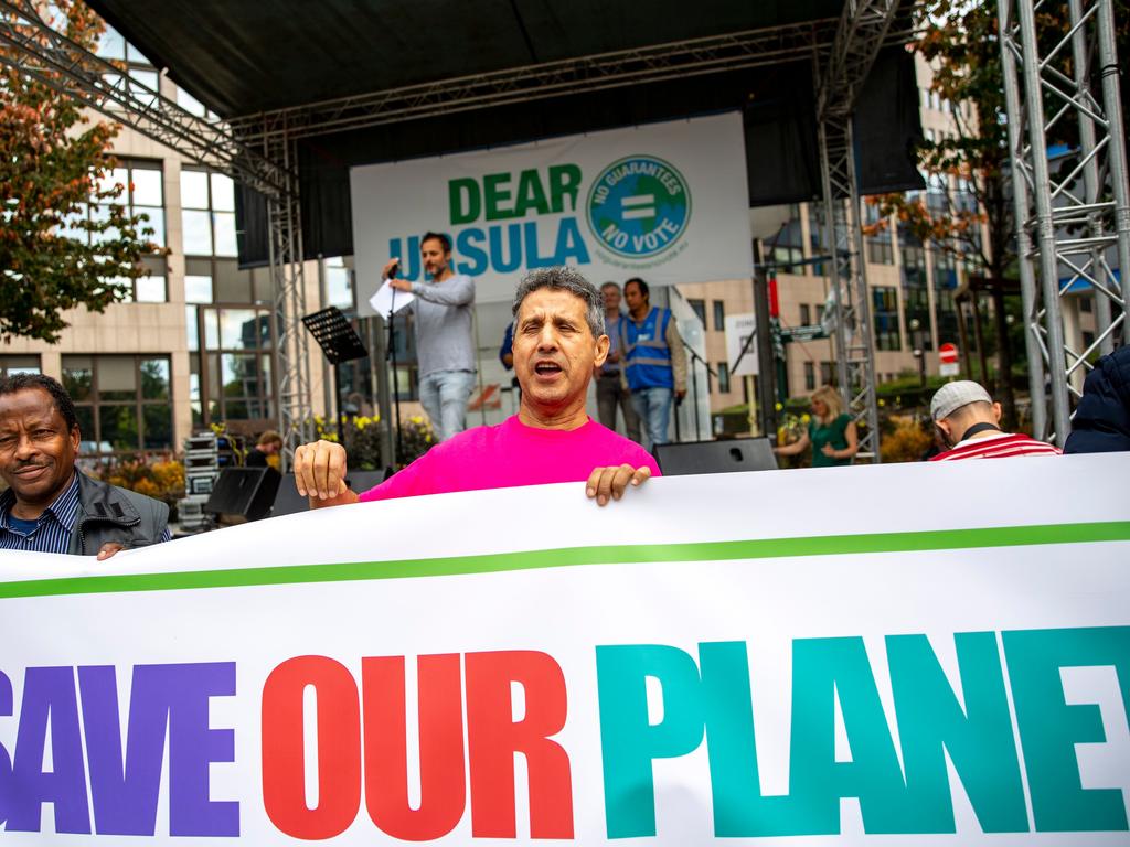 Protesters in Brussels hold a banner during a demonstration for the climate. Picture: AFP