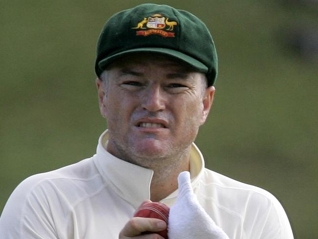 Australia's Stuart MacGill wipes a ball during the third day of the second cricket Test match against West Indies at the Sir Vivian Richards Stadium in St. John's, Antigua, Sunday, June 1, 2008. Leg-spinner MacGill, 37, stunned the cricket world by announcing on Sunday his international retirement midway through the second Test, his 44th, just months after undergoing wrist surgery in a bid to prolong his career. (AP Photo/Andres Leighton)