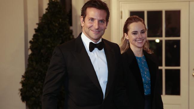 WASHINGTON, DC - FEBRUARY 11: Actor Bradley Cooper, left, and Suki Waterhouse arrive to a state dinner hosted by U.S. President Barack Obama and U.S. first lady Michelle Obama in honor of French President Francois Hollande at the White House on February 11, 2014 in Washington, DC. Obama and Hollande said the U.S. and France are embarking on a new, elevated level of cooperation as they confront global security threats in Syria and Iran, deal with climate change and expand economic cooperation. (Photo by Andrew Harrer-Pool/Getty Images)