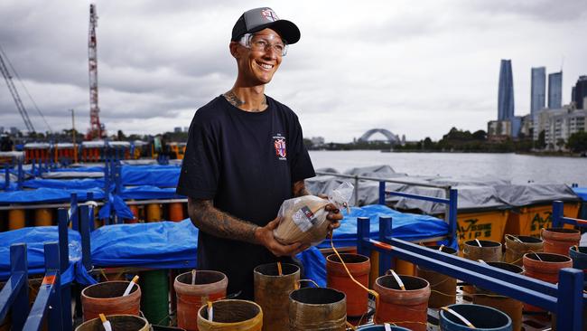 Jonathon Tyler prepping some of the fireworks. Picture: Sam Ruttyn