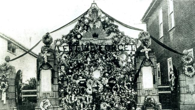 The Memorial Gates in Mary St were completely covered with wreaths for Anzac Day 1935.