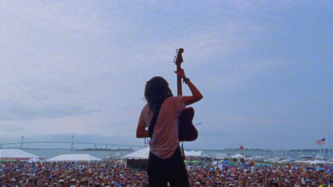 Musician Courtney Barnett plays to thousands of fans at a music festival in a scene from the Anonymous Club. Picture: Supplied.