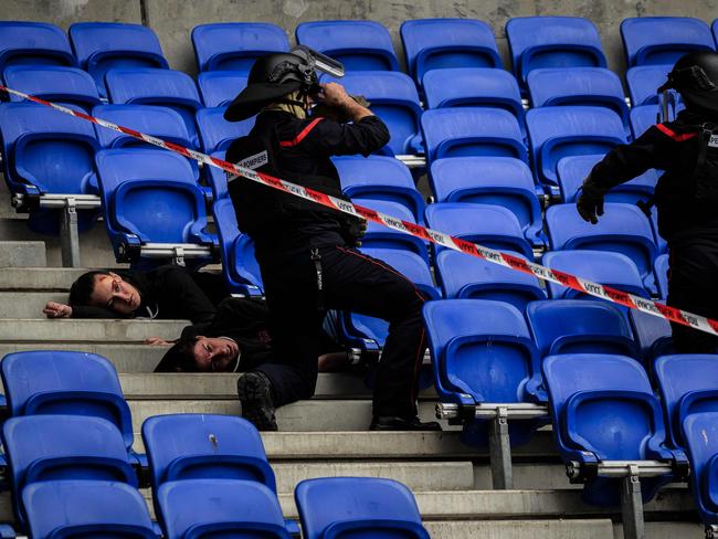 Police officers, military personnel, rescue workers and firefighters take part in an exercise simulating a terrorist attack on April 5, 2024 at the Groupama Stadium in Decines-Charpieu. Picture: AFP