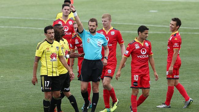 The referee awards a second yellow card to Albert Riera of Wellington Phoenix.