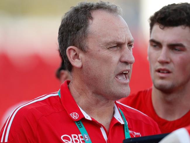 GOLD COAST, AUSTRALIA - SEPTEMBER 20: John Longmire, Senior Coach addresses his players during the 2020 AFL Round 18 match between the Sydney Swans and the Geelong Cats at Metricon Stadium on September 20, 2020 in Gold Coast, Australia. (Photo by Michael Willson/AFL Photos via Getty Images)