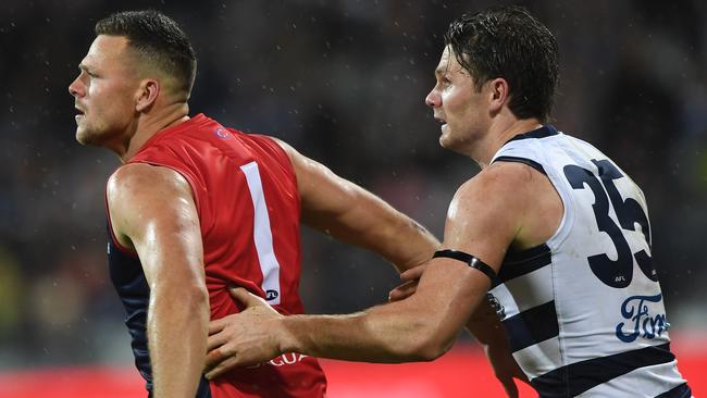 Steven May of the Demons (left) and Patrick Dangerfield of the Cats during the Round 2 match in Geelong. Picture: AAP Image/Julian Smith