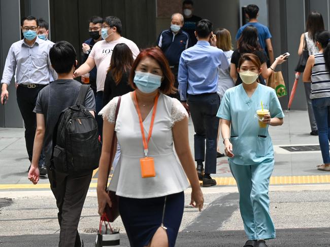 Residents have been encouraged to socialise outdoors, as a measure to curb infections. Picture: Roslan Rahman / AFP.