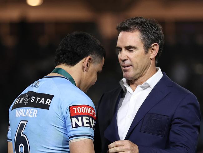 Brad Fittler head coach of the Blues presents the Player of the Match award to Cody Walker of the Blues following game three.