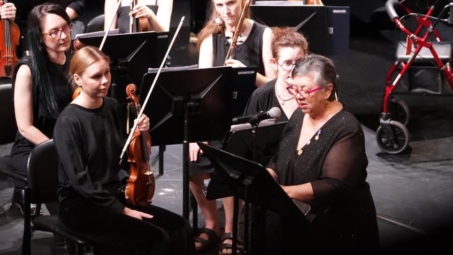 Aunty B addresses the audience ahead of the premiere. Gurrulwa Guligi (Big Wind) by Bilawara Lee and Netanela Mizrahi, a reflection on Cyclone Tracy 50 years after it devastated Darwin, was premiered by the Darwin Symphony Orchestra in 2024. Picture: Darwin Symphony Orchestra.