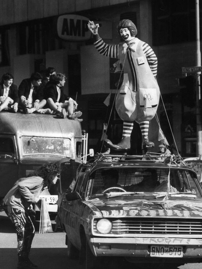 A Ronald McDonald statue is tied to top of car during the Adelaide University Prosh Day parade in 1987.