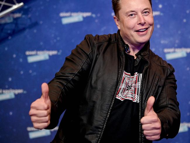 (FILES) In this file photo taken on December 01, 2020, SpaceX owner and Tesla CEO Elon Musk poses as he arrives on the red carpet for the Axel Springer Awards ceremony, in Berlin. - Tesla reported another round of record quarterly profits on January 25, 2023, while confirming its long-term production outlook in spite of concerns about rising competition and macroeconomic headwinds. (Photo by Britta Pedersen / POOL / AFP)