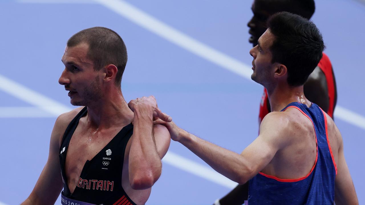 Mills pushes Hay’s hand away. (Photo by Al Bello/Getty Images)