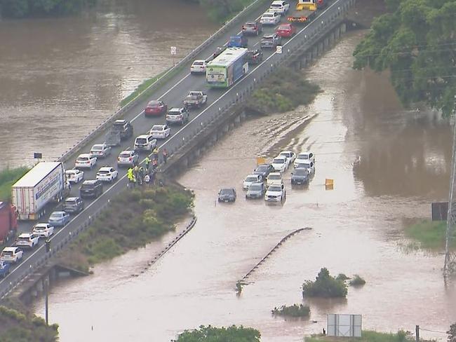 Cars underwater as flash flooding sweeps through Brisbane. Picture: Nine News